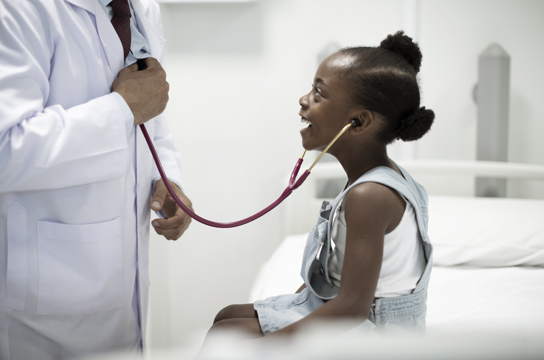 Doctor and smiling child checkup