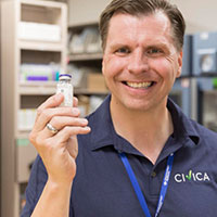 Dan Liljenquist, Board Chair holding a vial